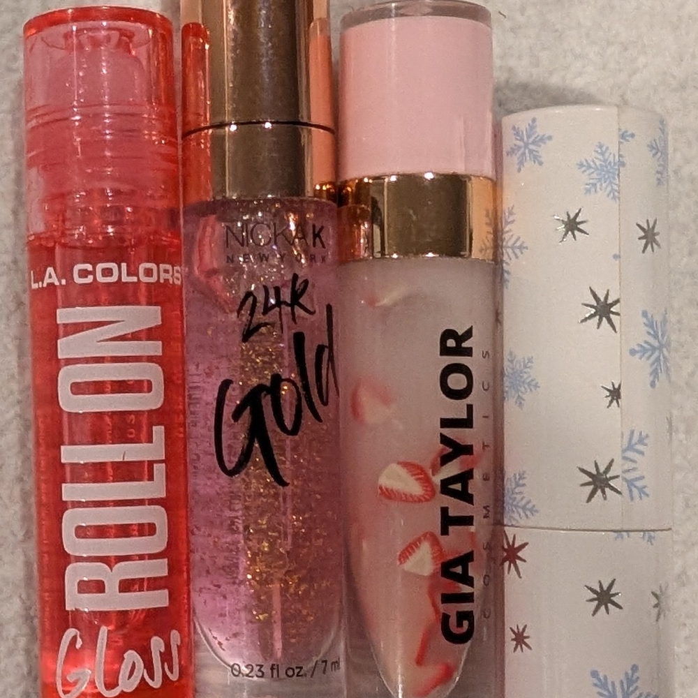 Bundle of 4 brand new lip glosses — all new without box and perfect for gifting